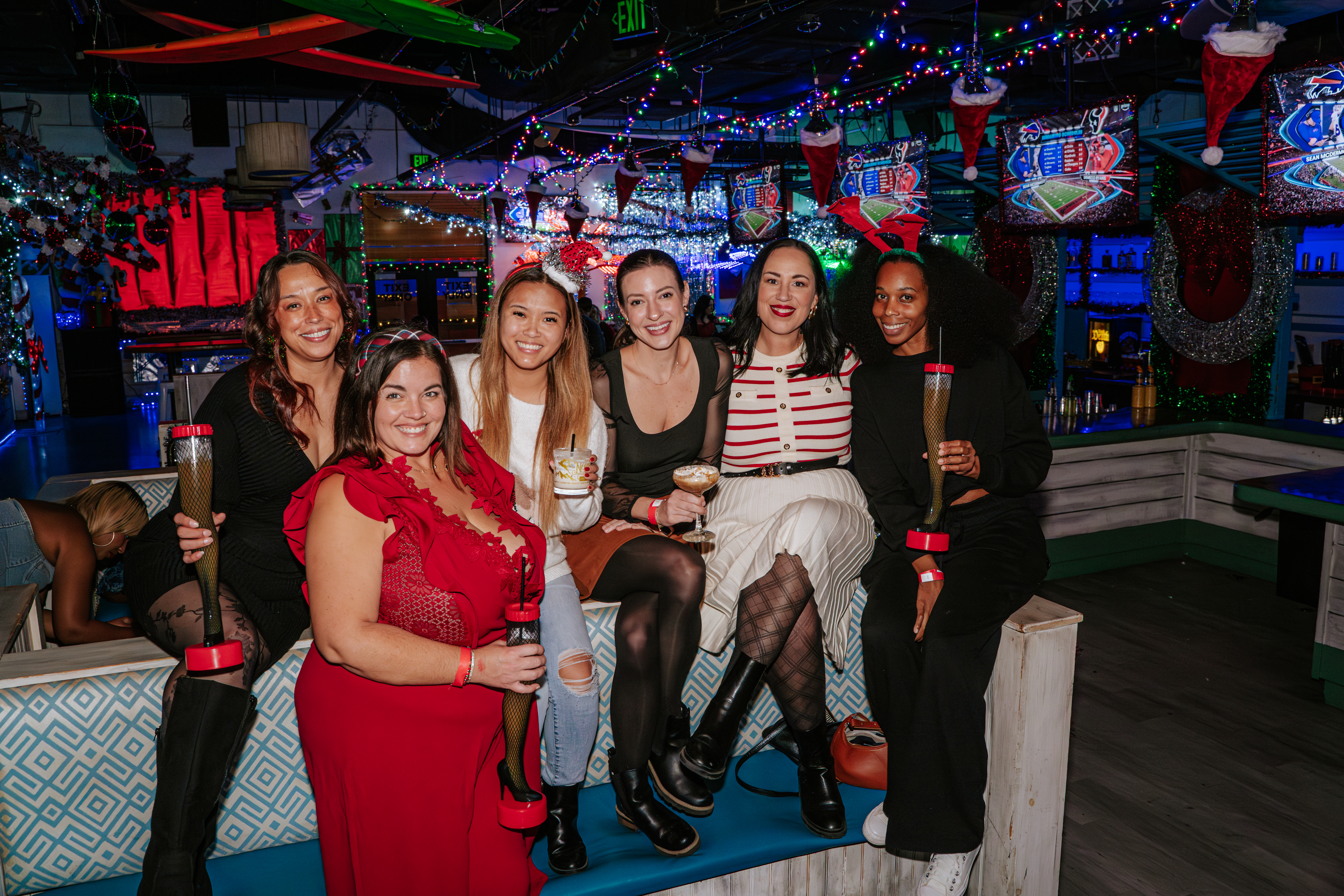 A group of friends enjoy at night out at the festive Tinsel Tavern bar.