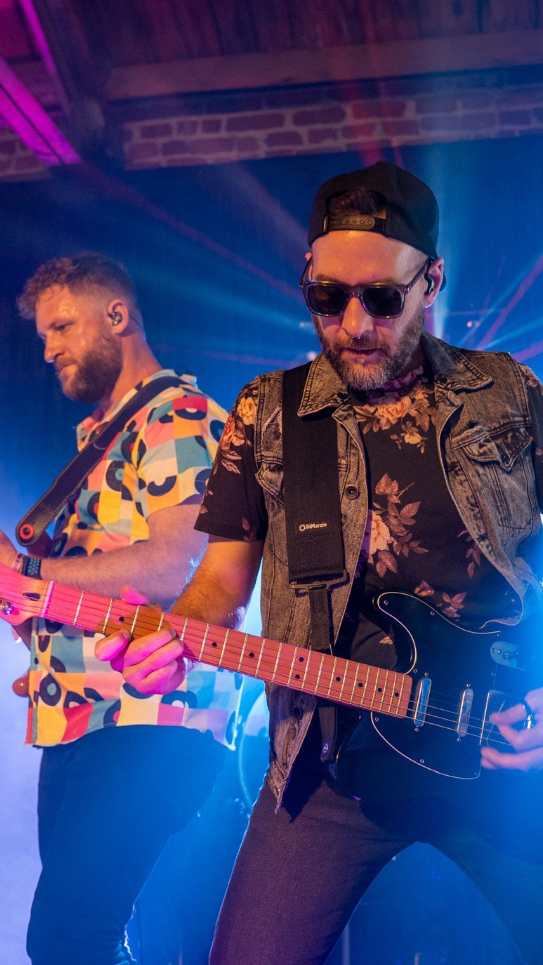 Two guitarists perform on stage at the MPI Gala.