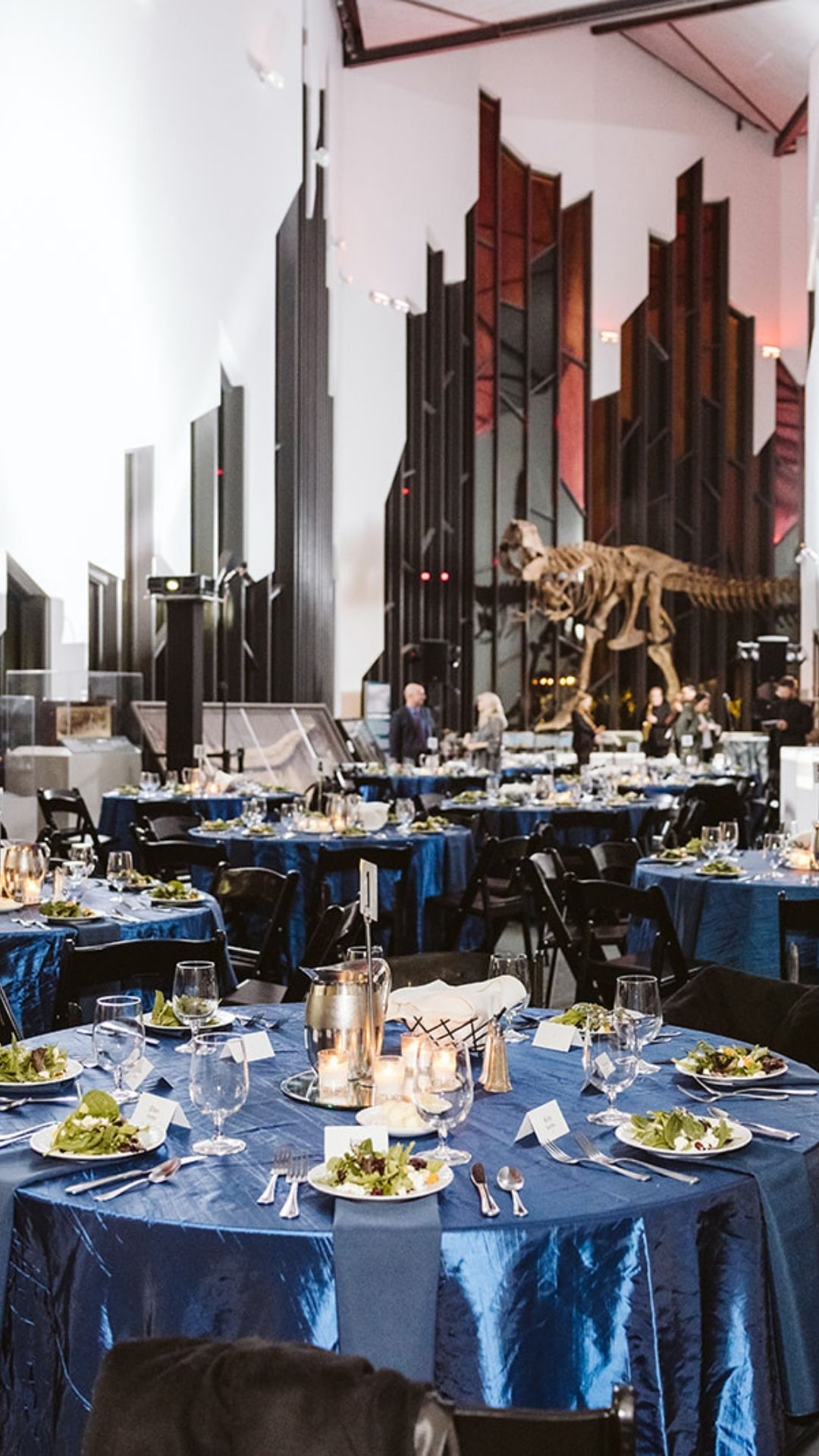 Convention space with tables set for the MPI gala. 