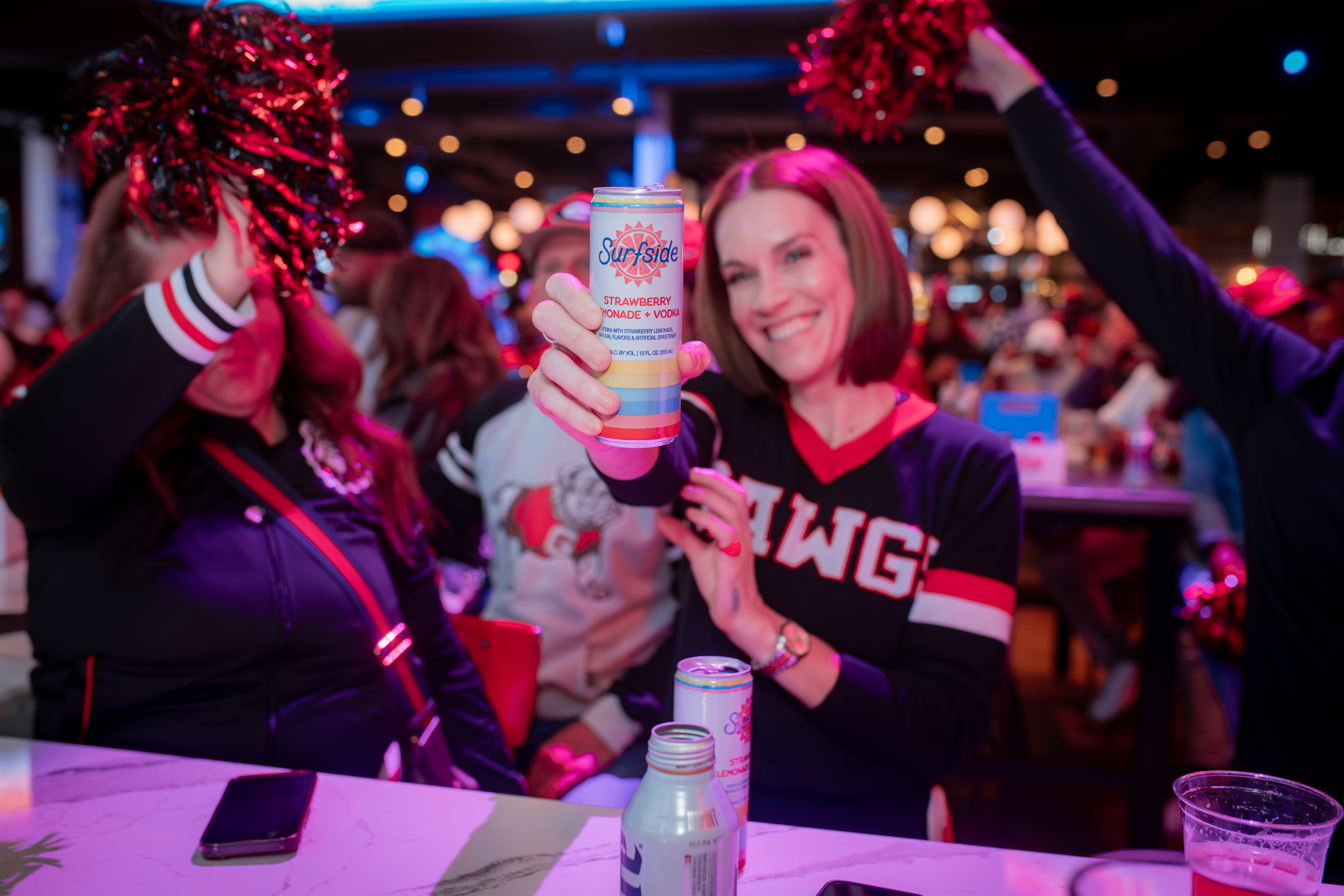 Sport fans celebrating a big win at Sports and Social Atlanta