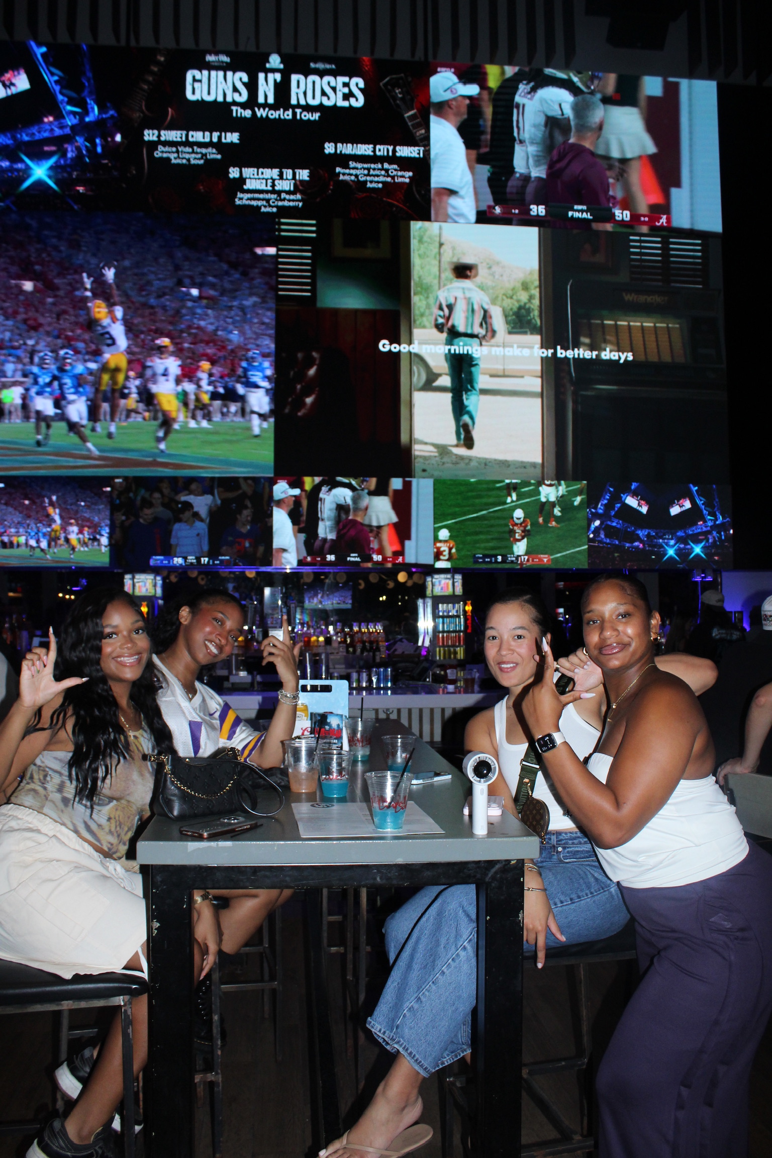Sport fans celebrating a big win at Sports and Social Atlanta