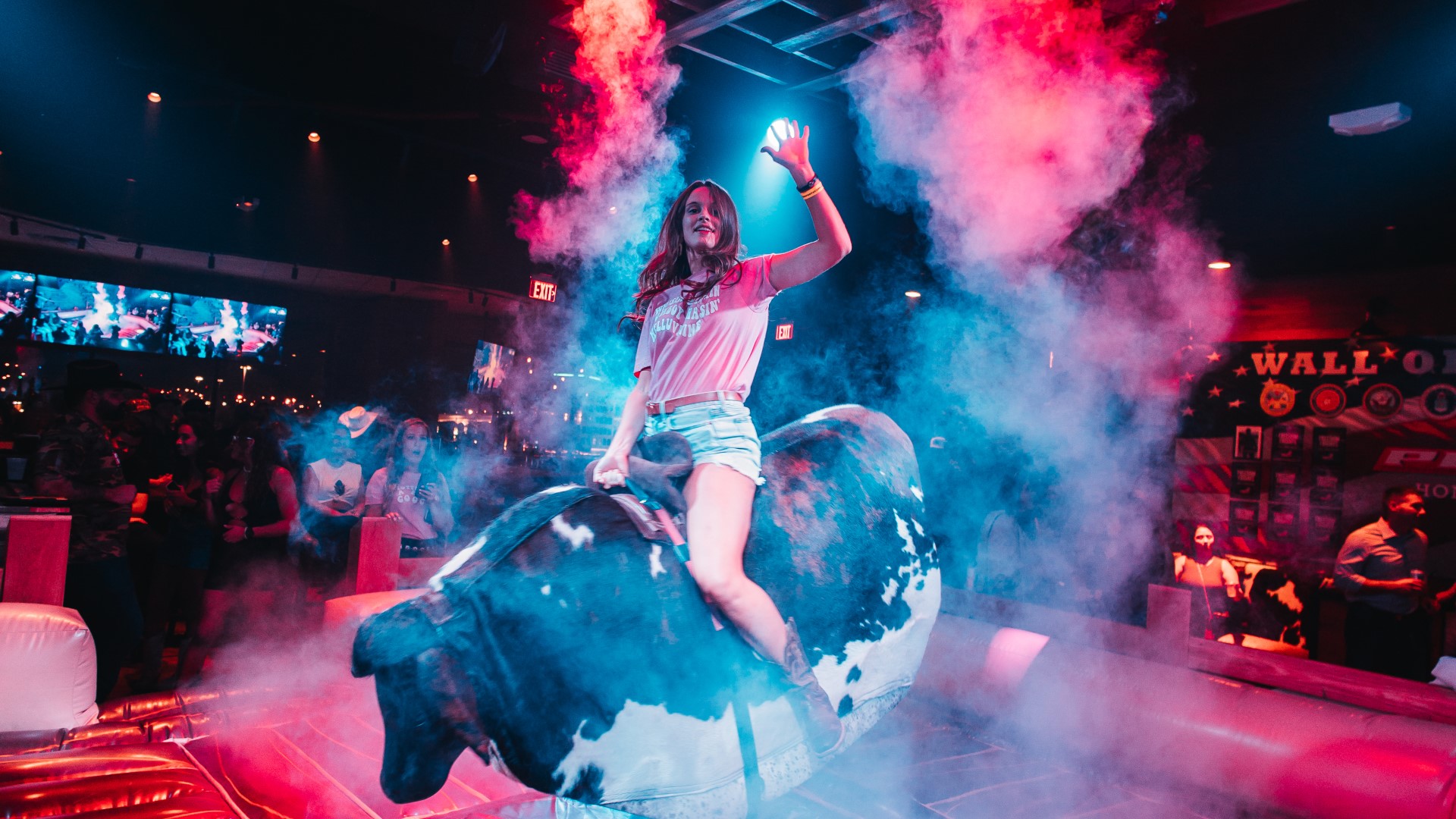 Woman riding the mechanical bull at PBR Cowboy Bar Nashville Live!