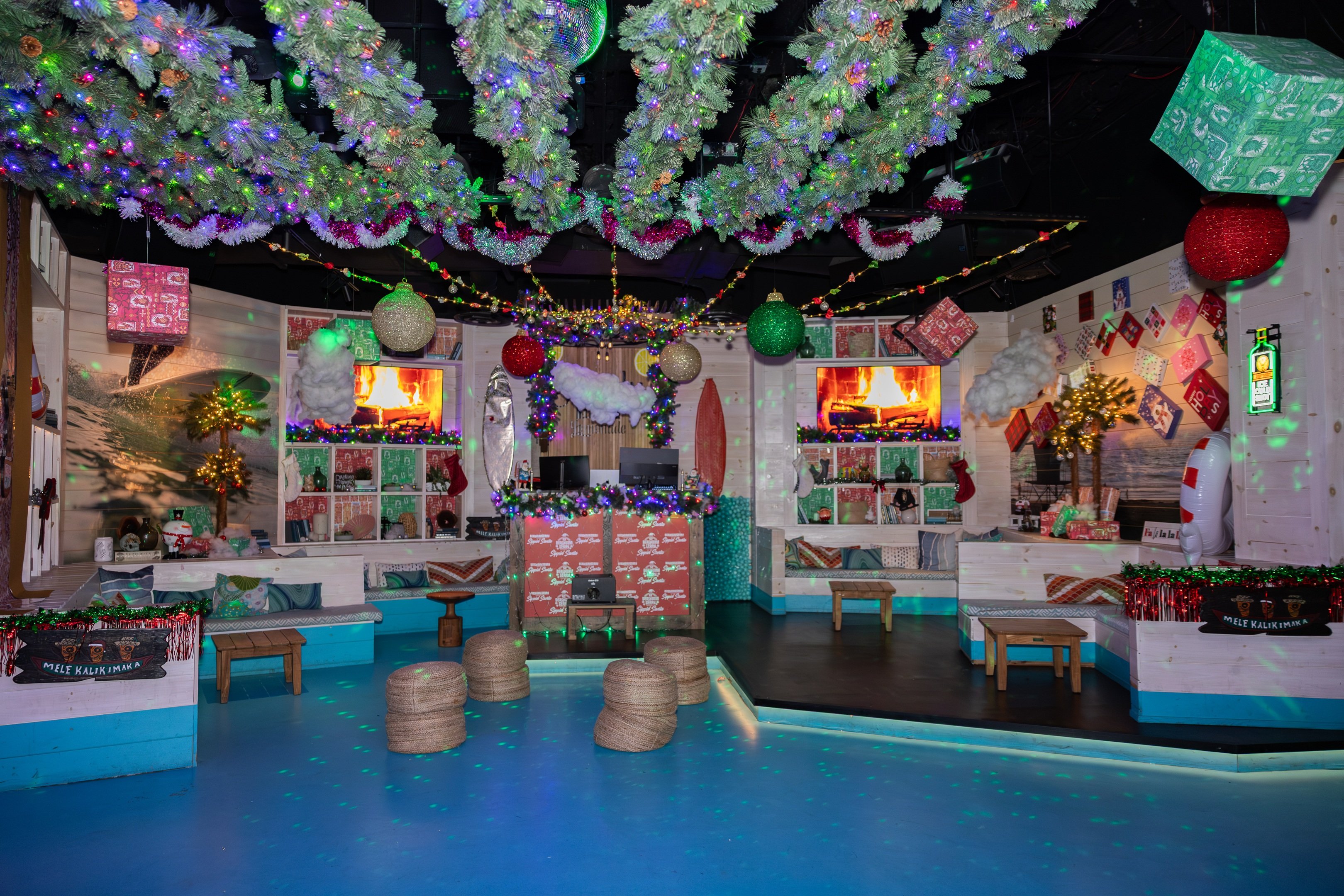 Shark Bar lounge area decorated with holiday garlands on the ceiling and other festive decorations throughout.