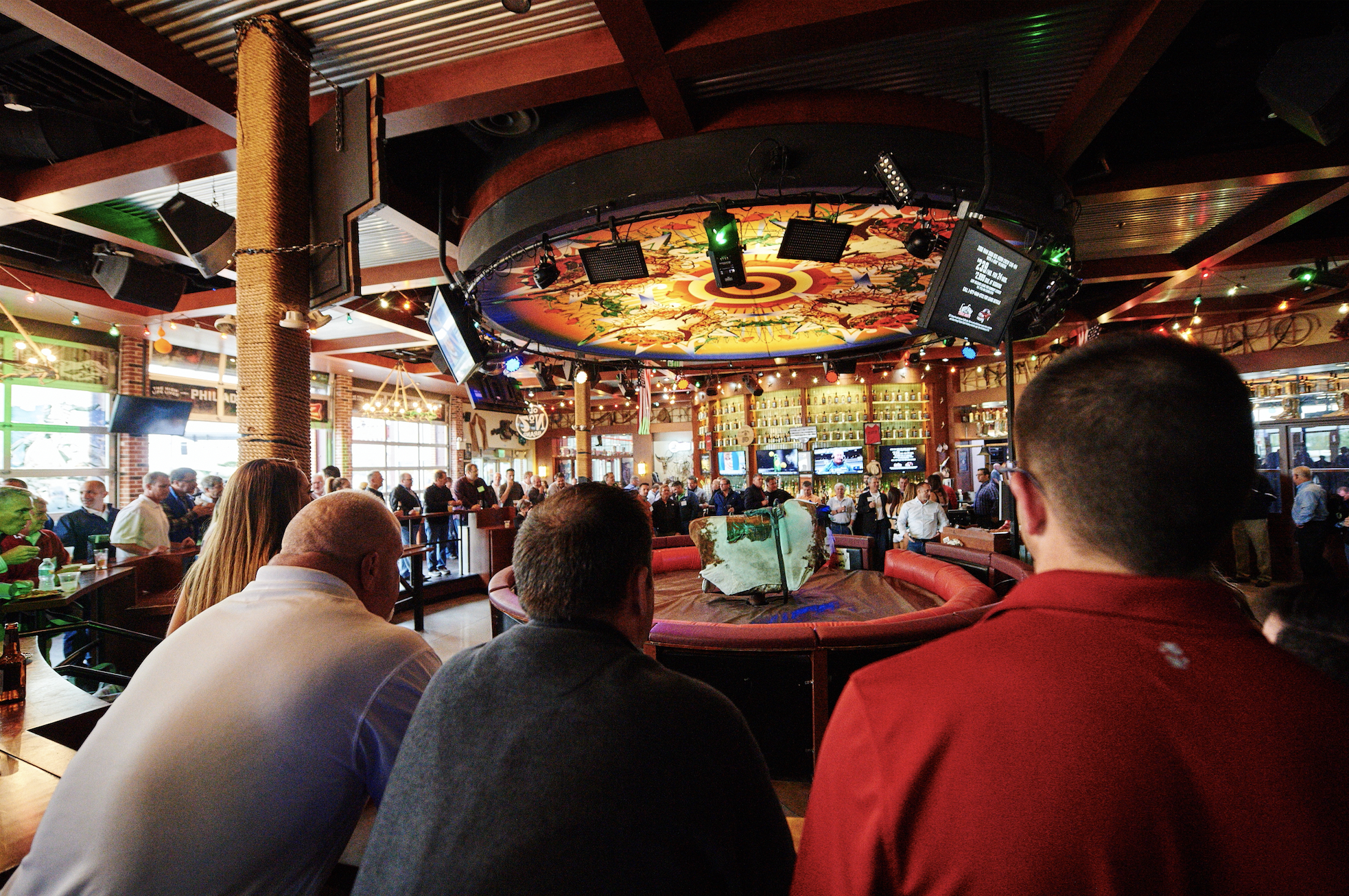 Guests in the mechanical bull area of PBR Philly.
