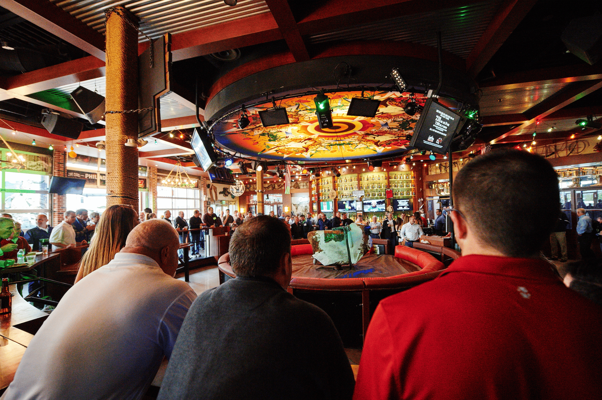 Guests in the mechanical bull area of PBR Philly.