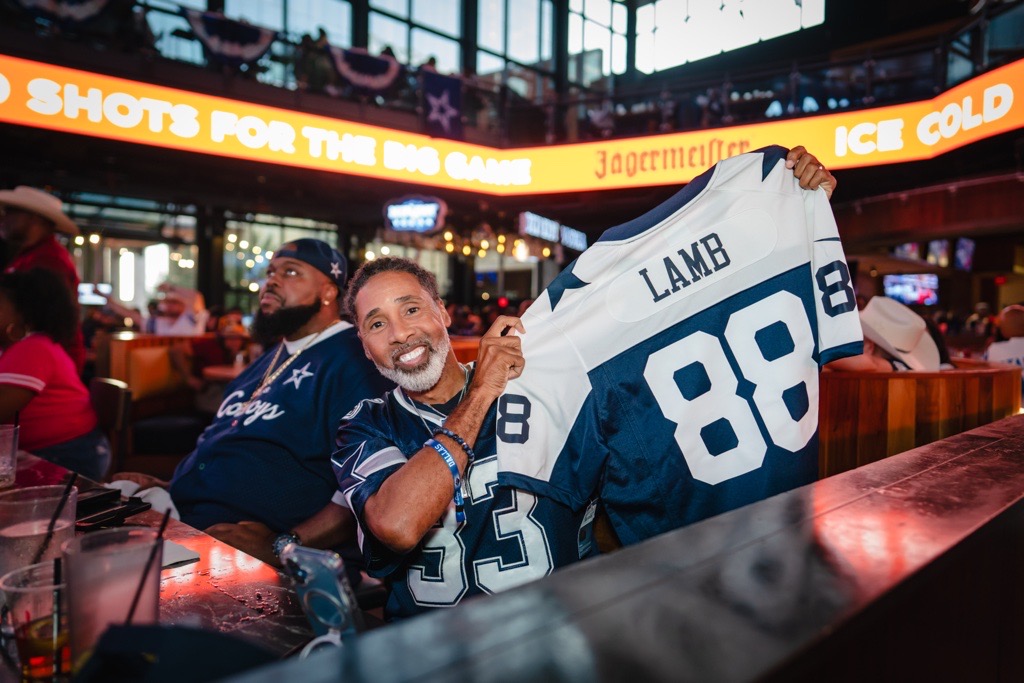 Dallas fan posing with a 88 jersey that he just won for entering to win a jersey at Texas Live