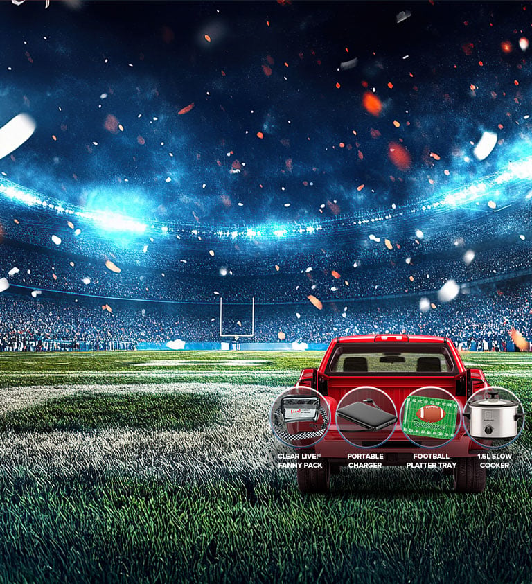 gridiron tailgate text on a football field next to a red truck