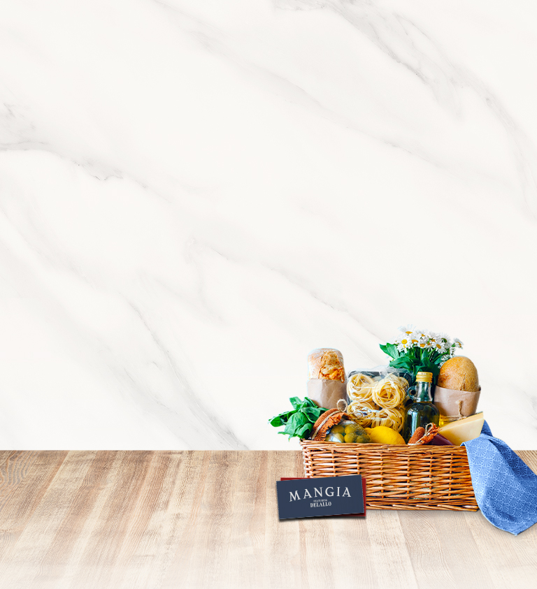 mangia gift basket and gift card on neutral background