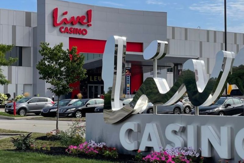 Silver scripted letters spell out Live! at the entrance of Live! Casino Pittsburgh, welcoming you to your destination.