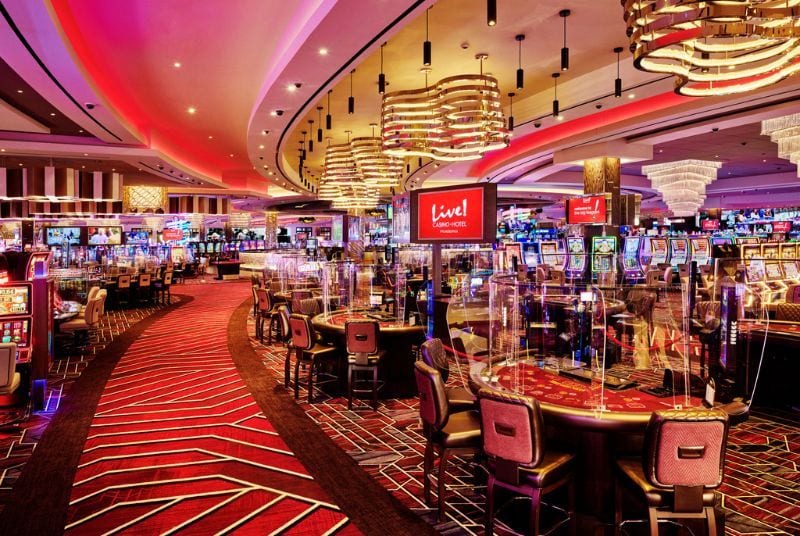 Inside Live! Casino, banks of slot machines and pristine poker tables await under beautiful gold and crystal light fixtures. 