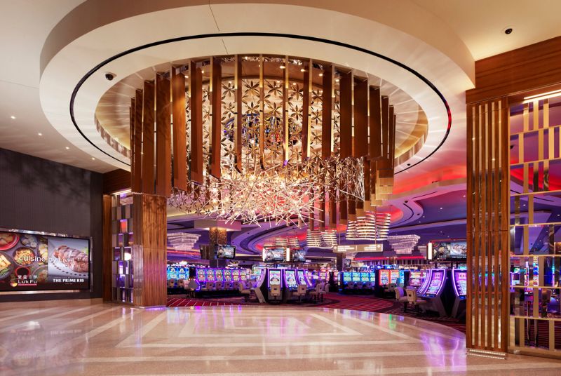 In the lobby by the casino, an elaborate sculpture of wood, metal flowers, and LED starbursts hangs from a circular fixture.