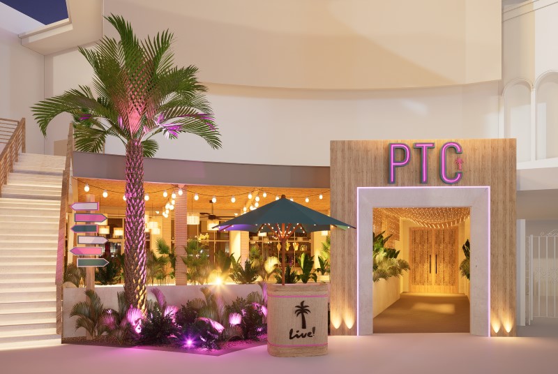 Palm Tree Club entrance featuring host stand and palm tree.