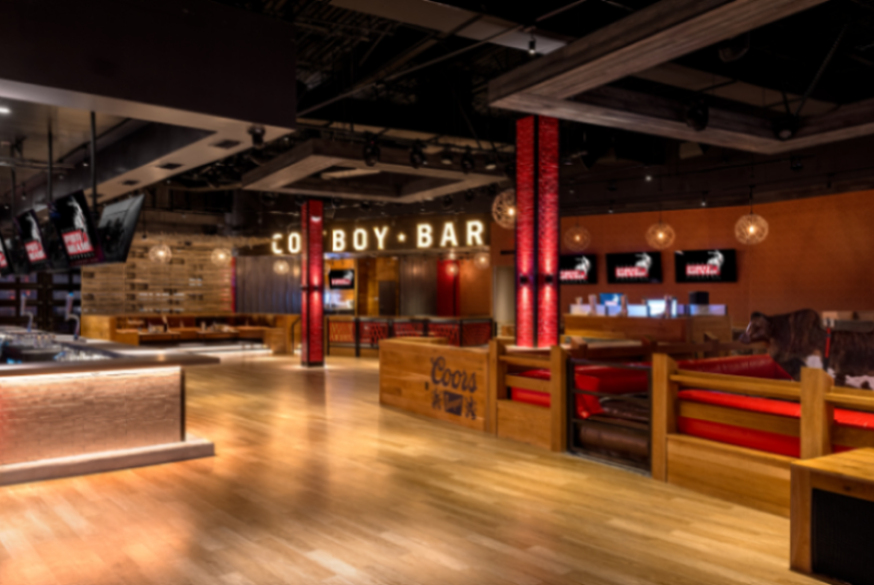 PBR Miami Cowboy Bar with empty dancefloor, bar, seating and mechanical bull areas.