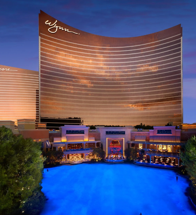 Photo of Wynn Resort Las Vegas Exterior at dusk with Lake of Dreams and Tower Suites Atrium
