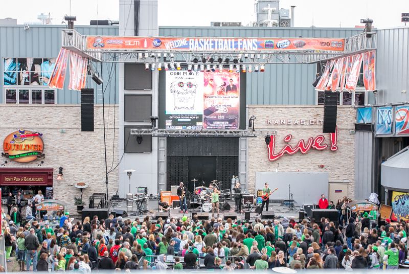 A live band is center stage as a St. Patrick's Day crowd cheers them on in Kansas City.