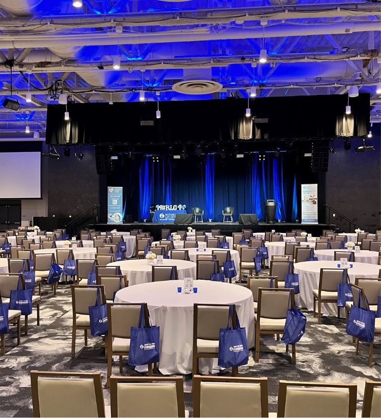 Photo of Market Ballroom set in crescent rounds for 250 guests.
