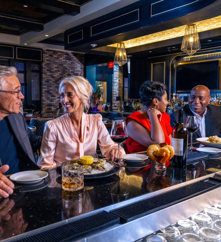 Patrons eating and drinking at a restaurant