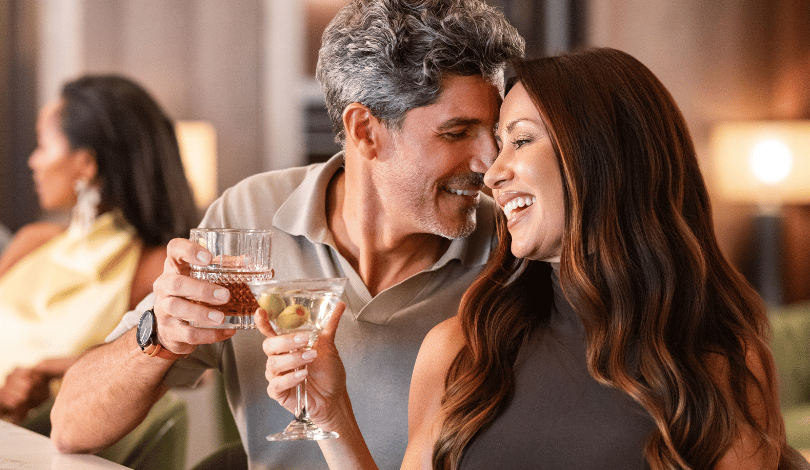 image of a couple sitting closely at the bar at ridotto grand cafe