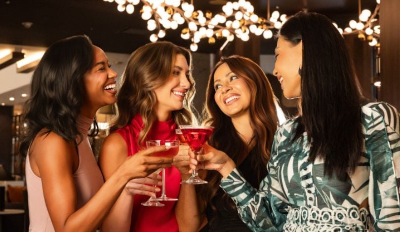 image of four women holding cocktail glasses at ridotto grand cafe bar