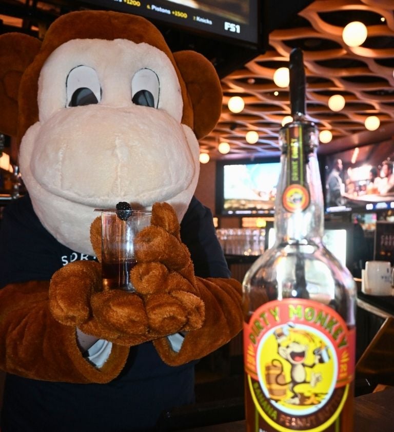 three images of the dirty monkey whiskey monkey at sports and social louisiana