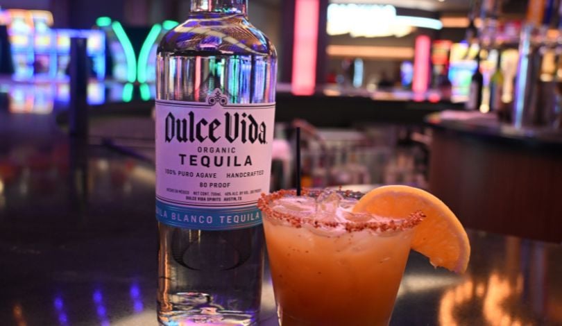 image of a dulce vida tequila bottle and an orange margarita in a cocktail class at center bar inside live! casino louisiana