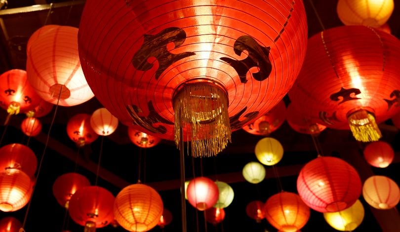 image of red lanterns hanging from the ceiling