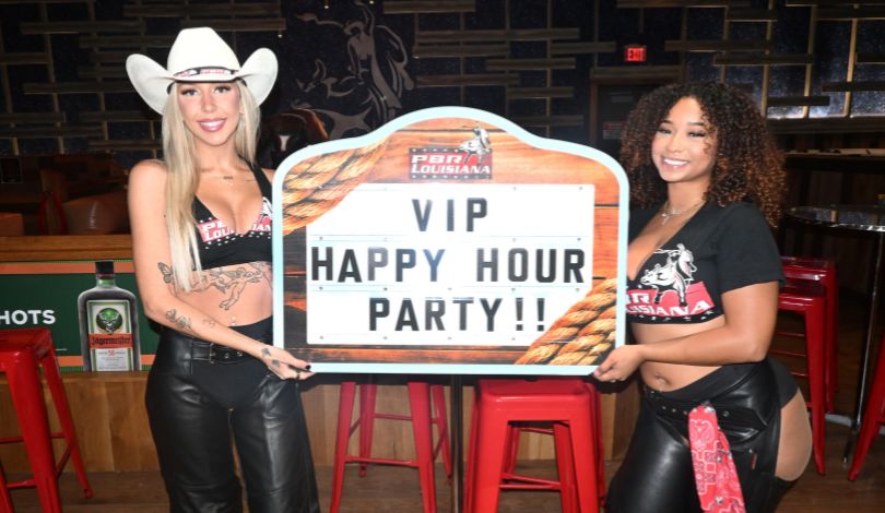 image of two girls wearing pbr buckle bunny outfits and holding a sign that says VIP Happy Hour Party!!