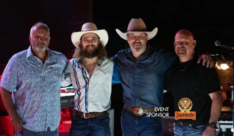 image of four member of tailgate poets band standing on a stage