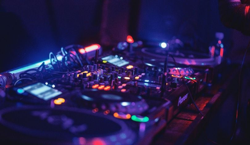 image of DJ equipment with neon lights