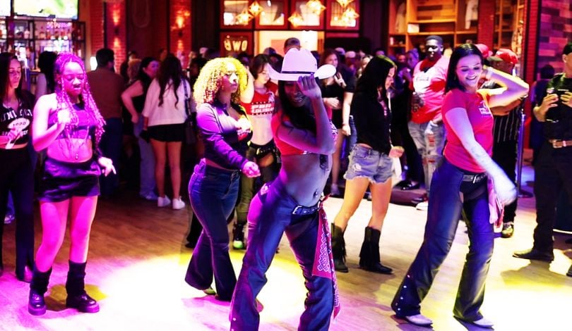 image of girls dancing inside pbr louisiana