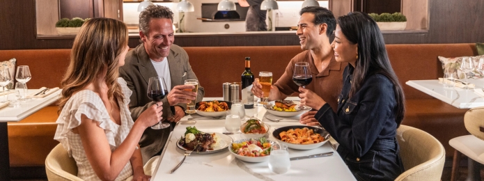 Two couples dining together at Ridotto Grand Cafe