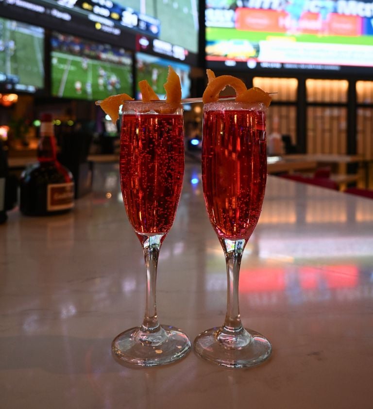 image of two red cocktails at sports & social louisiana
