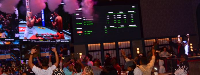 image of people cheering at sports & social