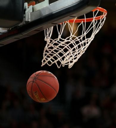 image of basketball coming out of a hoop