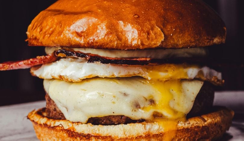 image of a burger with an egg on it