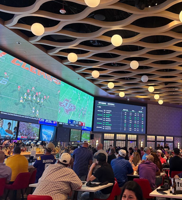 image of a packed house football watch party at sports & social louisiana
