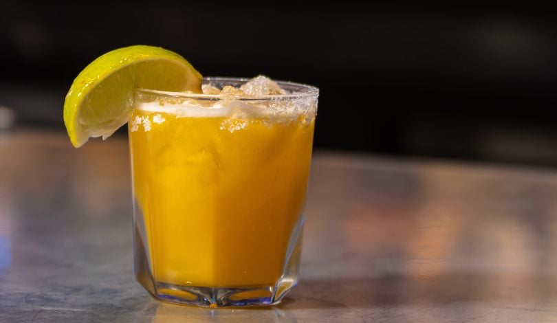 image of an orange cocktail in a short glass