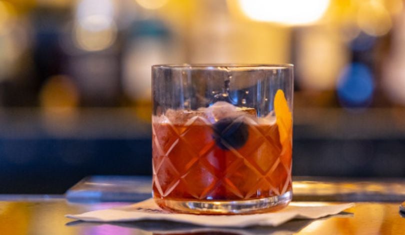 photo of an old fashioned cocktail in a bourbon glass