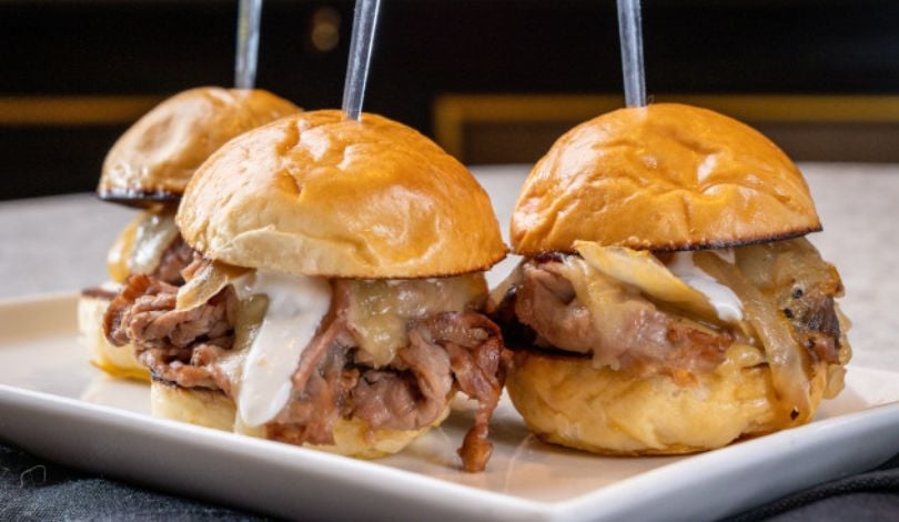 a photo of 3 prime rib sliders