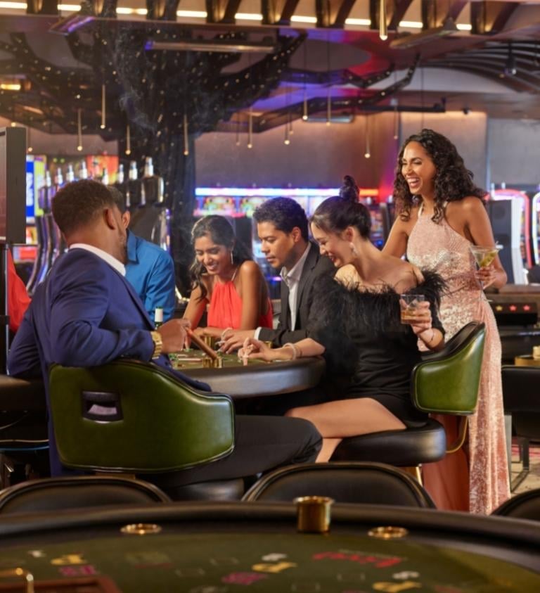 Group Playing Blackjack in Orchid Gaming & Smoking Patio®