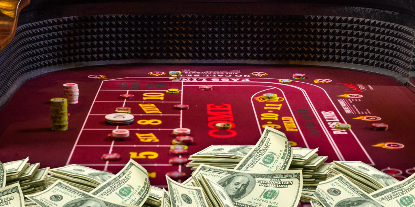 Image of a Craps table with chips and money piled up