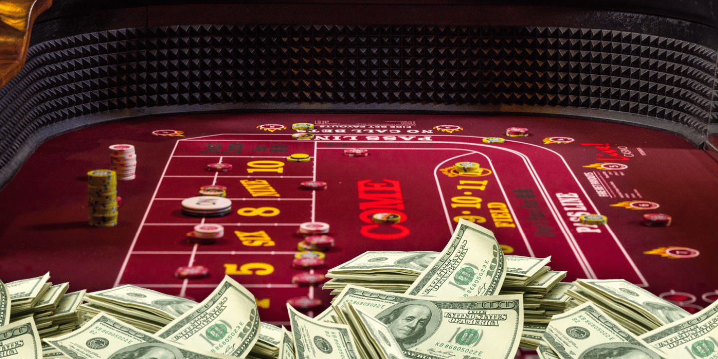 Image of a Craps table with chips and money piled up