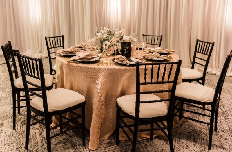 Table set up with greenery for wedding reception