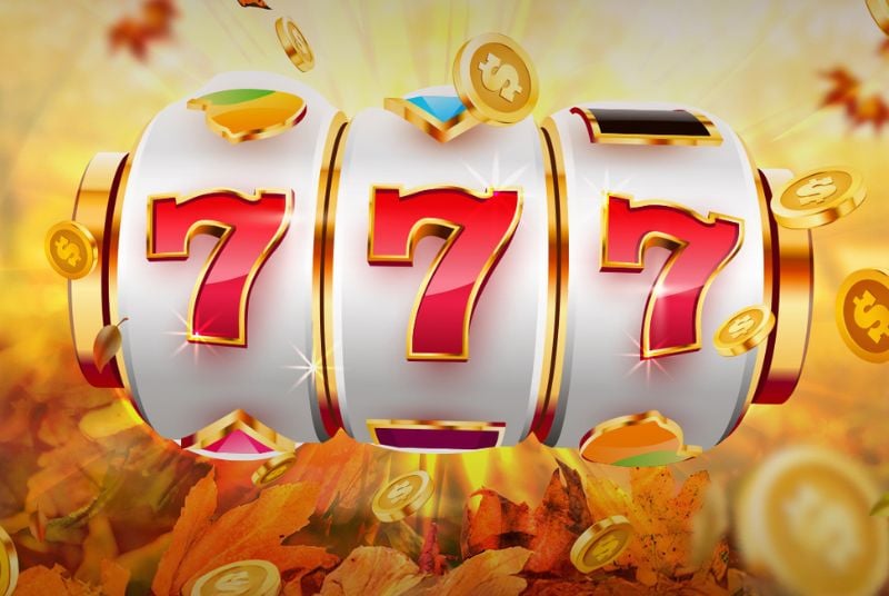 Feast of Wins Hot Seat. Slot machine numbers showing 777 on a background with golden coins flying everywhere.