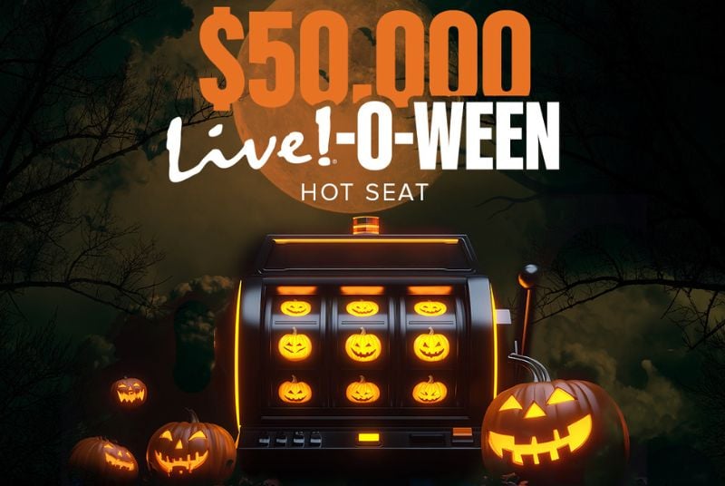 A slot machine that only produces jack-o-lanterns on a spooky black background with a full moon in the background.