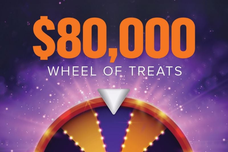 Purple and orange prize wheel on a bright purple background.