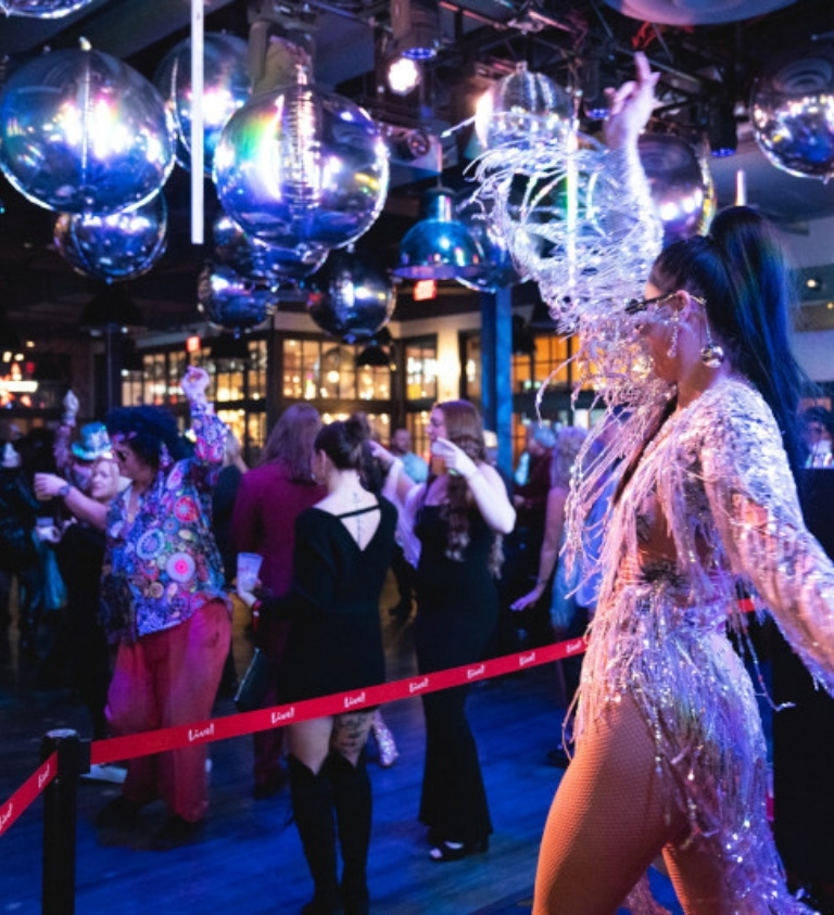 woman dancing at crowded party