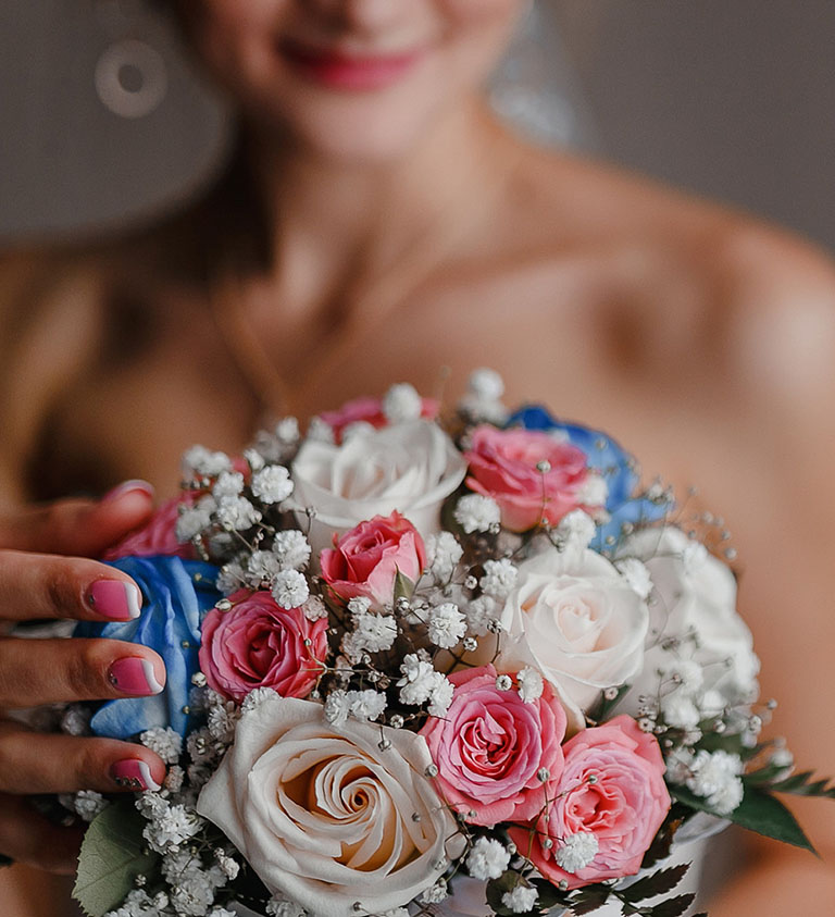 Woman Holding Wedding Bouquet