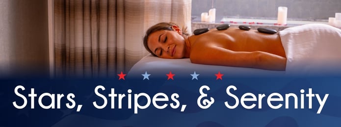 Woman laying down with hot stones on back