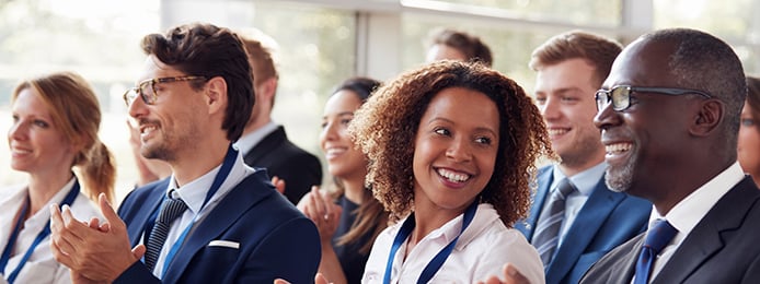 female looking at male and smiling.